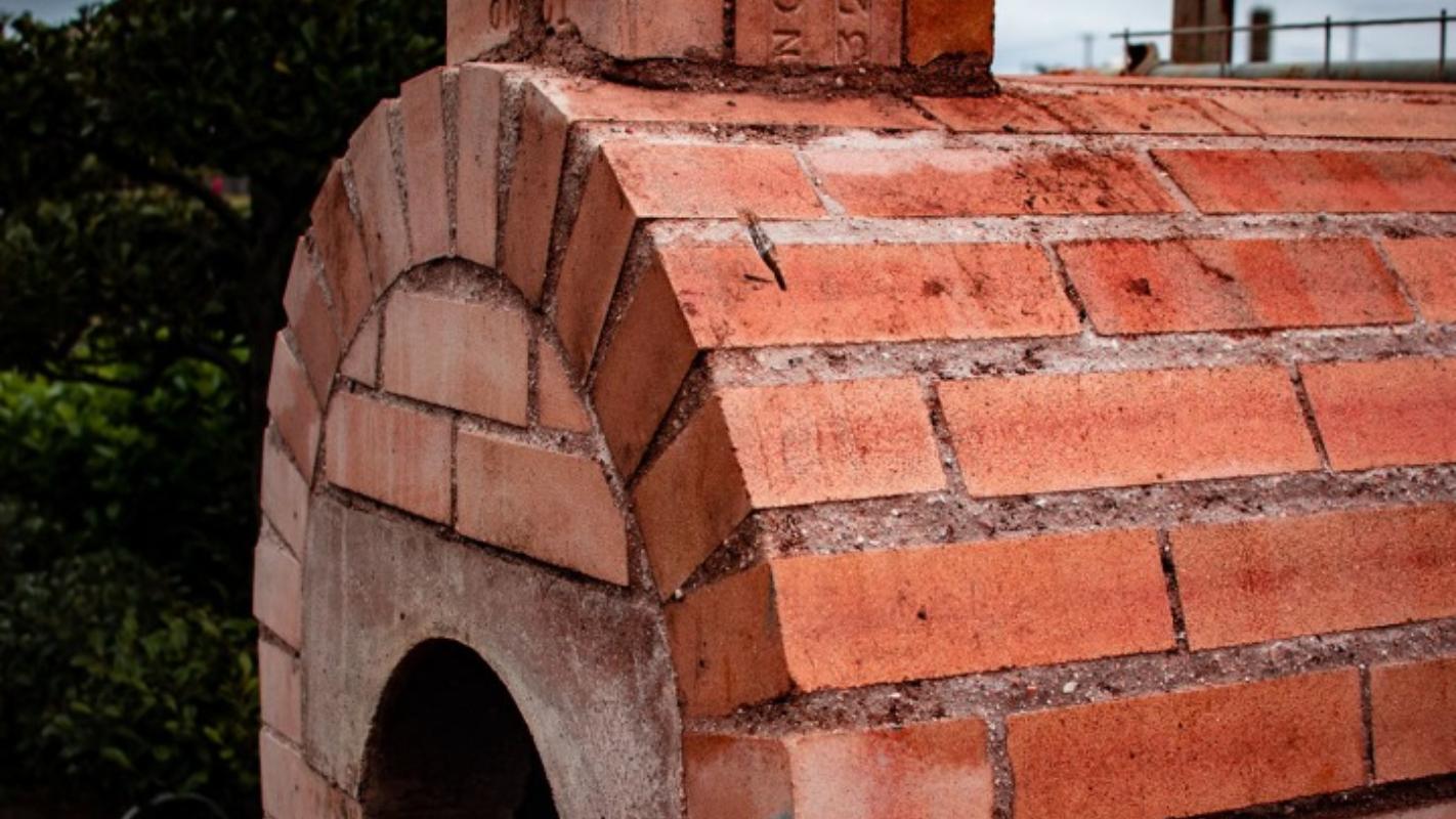 Outdoor pizza oven made of red fire brick
