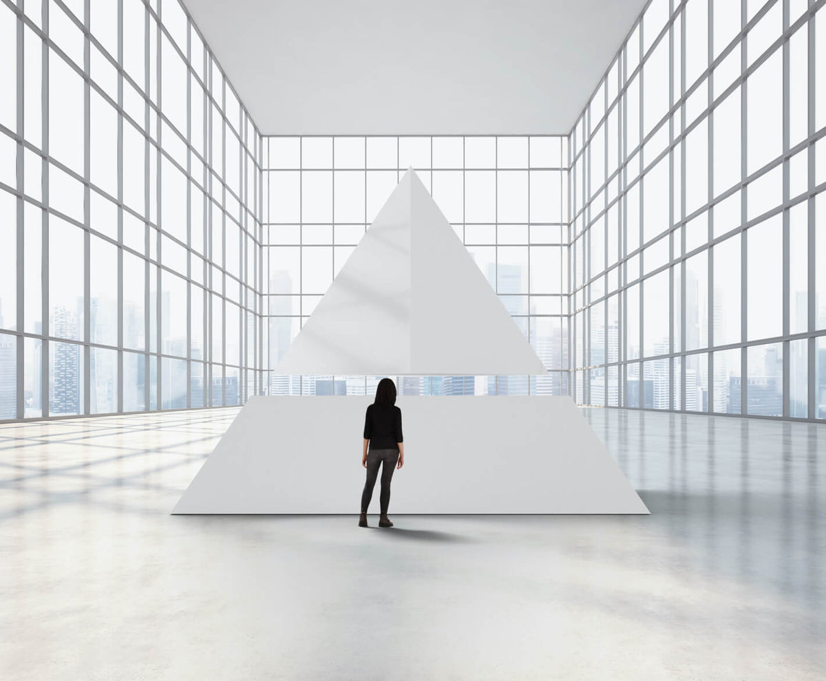 Big pyramid with a person standing in front of it
