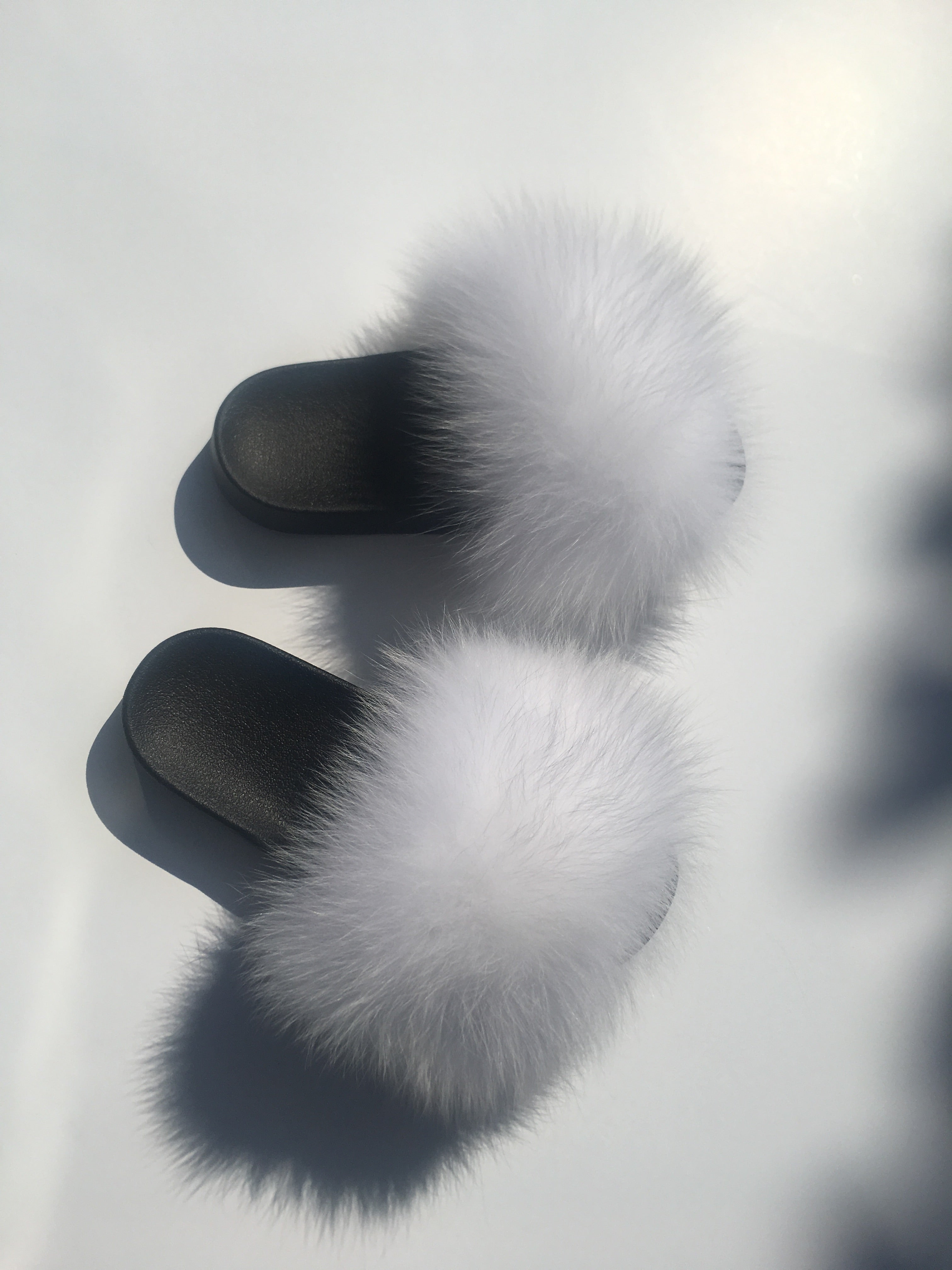 white fox fur slides