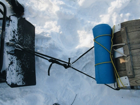 field rigged snowmobile toboggan