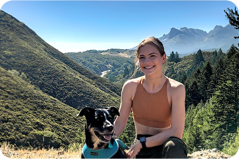 women on nature walk hiking in the outdoor with dog on hike