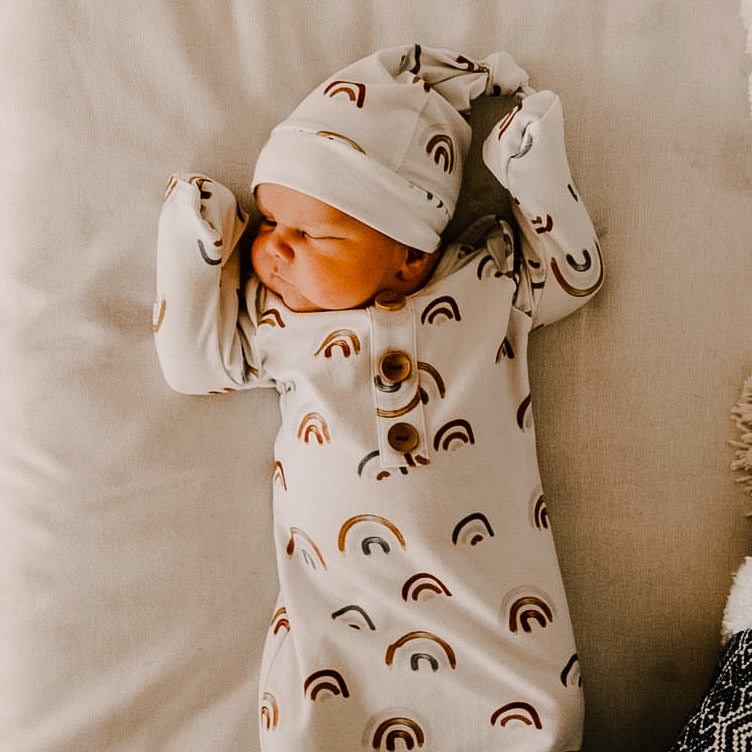 white newborn gown and hat