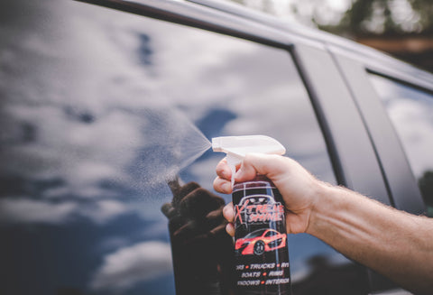 Xtreme Shine quick detailer spray wax being applied to glass window