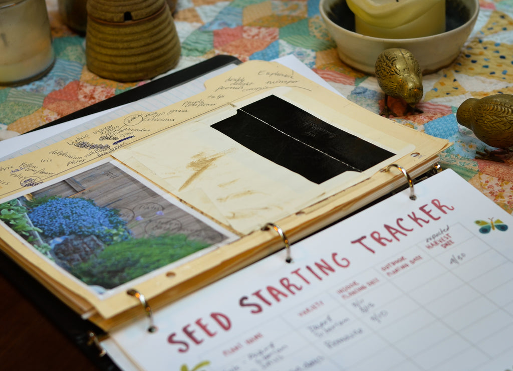 garden three ring binder with photographs and seed starting page