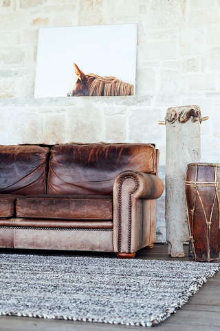 old brown couch with modern decor