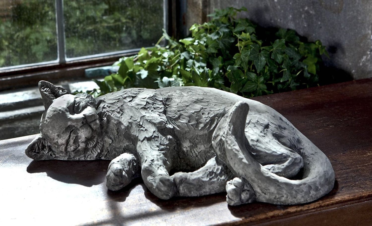 outdoor sleeping cat statue