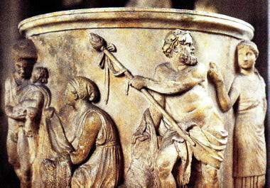 Dionysus depicted carrying a thrysus on a piece of ancient pottery.