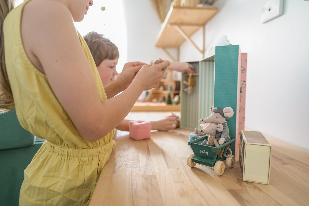 Girl and boy playing with Maileg toys