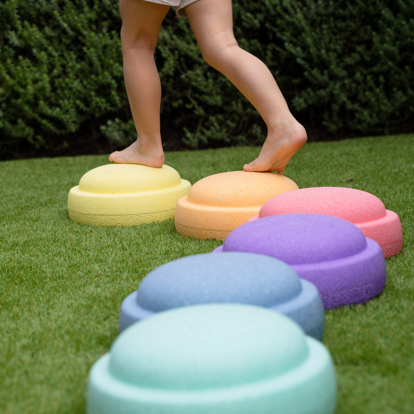 Outdoor play with pastel stacking stones from Stapelstein