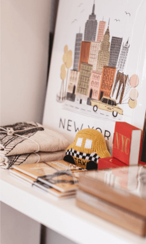 Baby toys on a shelf as decor for a nursery