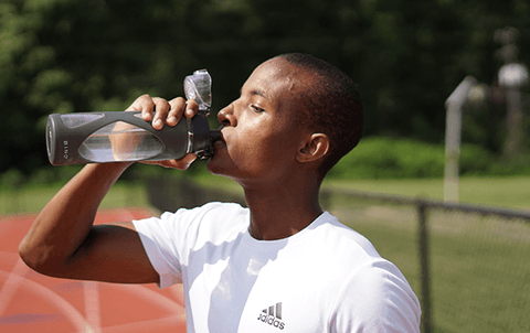 Runner drinking after workout