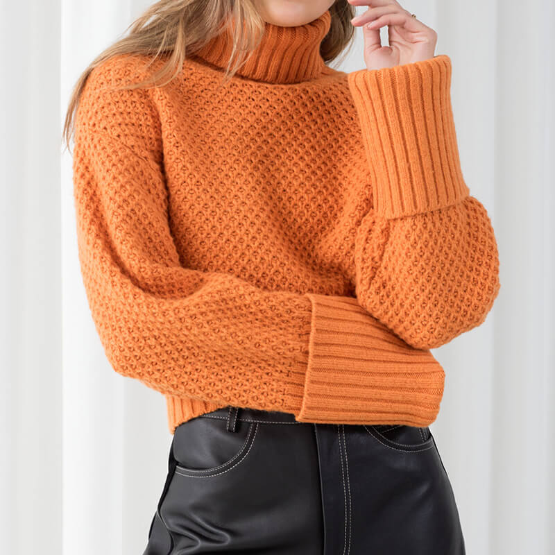 orange turtleneck sweater