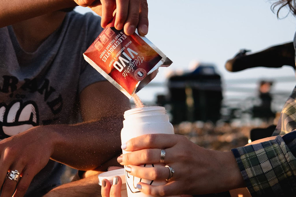 Man pouring electrolytes powder for rugby nutrition