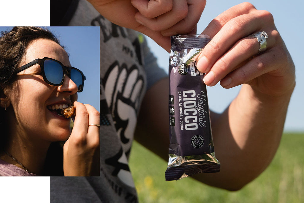 Woman eating energy bar for swimming nutrition