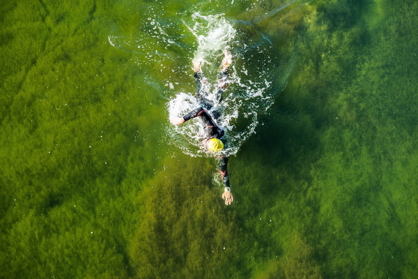 Athlete swimming in Ironman triathlon competition