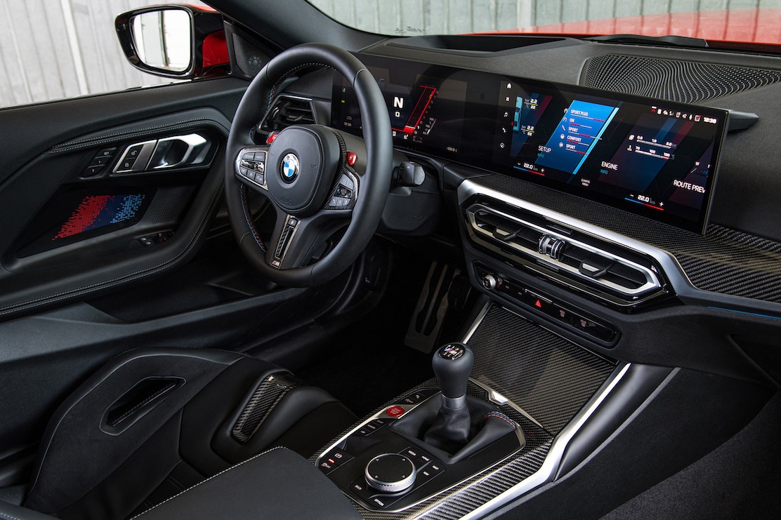 Interior View showing iDrive 8 in the 2023 BMW G87 M2 in Toronto Red