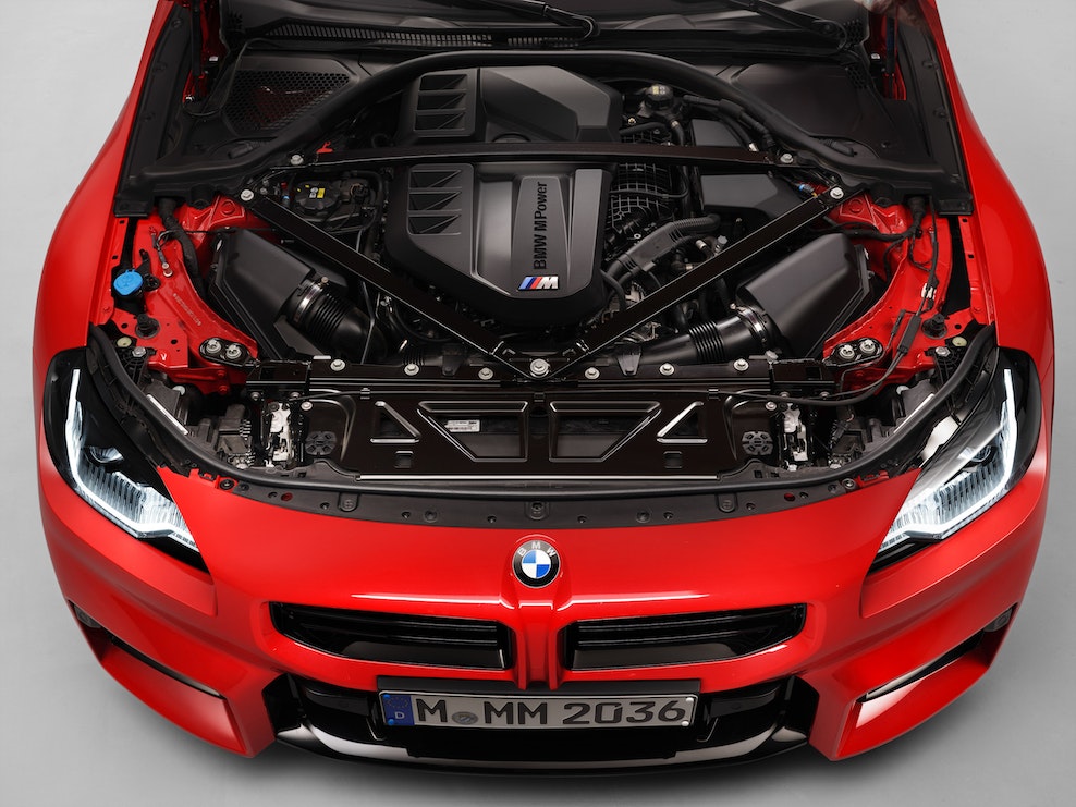 Under the bonnet hood of 2023 BMW G87 M2 in Toronto Red
