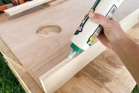 assembling diy hairpin leg cornhole board with wood glue