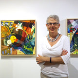 Liz Price with her paintings at Cerulean Arts