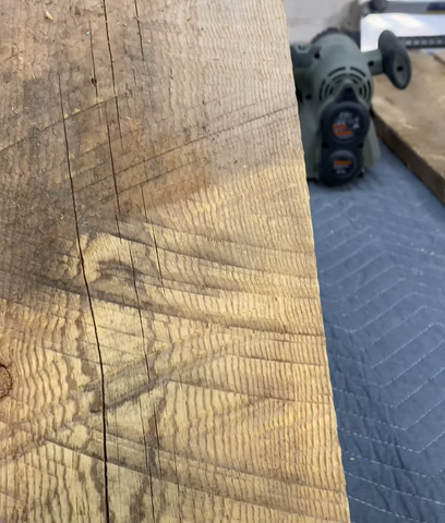 Close up of barnwood partially sanded