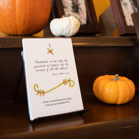 30 Days of Gratitude card sitting near pumpkins