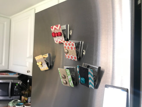 colorful decorative magnetic clips on a refrigerator