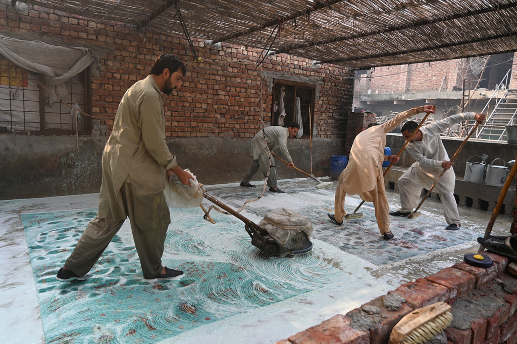 Washing the rugs with soap