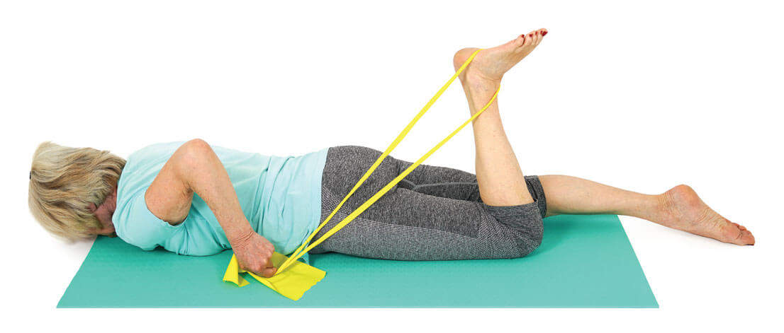 Figure 8.7 Knee extension against resistance in the prone position. Courtesy of Tim Allardyce, Rehabmypatient.com.