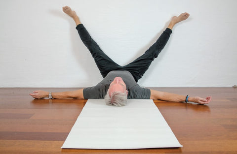 Wall straddle pose from Yin Yoga 50+ book