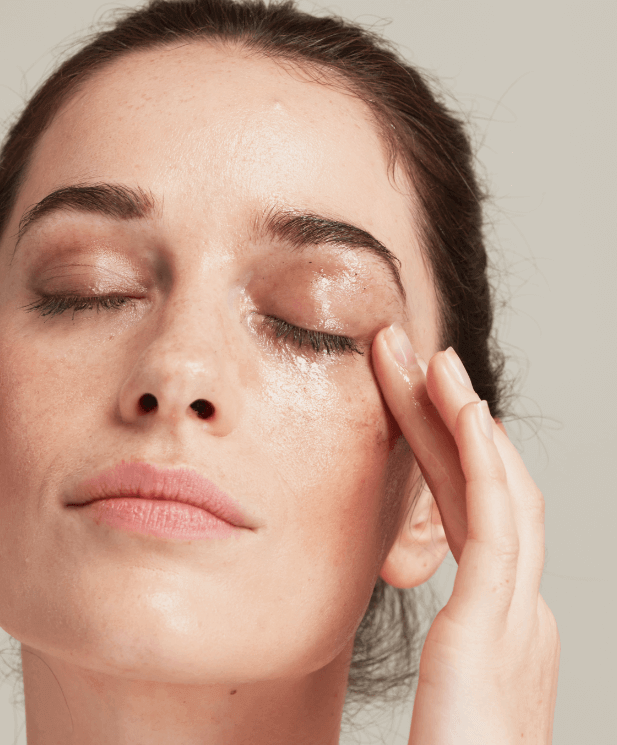 woman using eye makeup remover