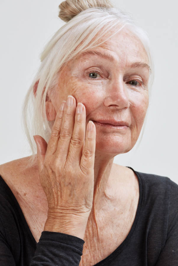  Woman using Pai Skincare Peptides booster