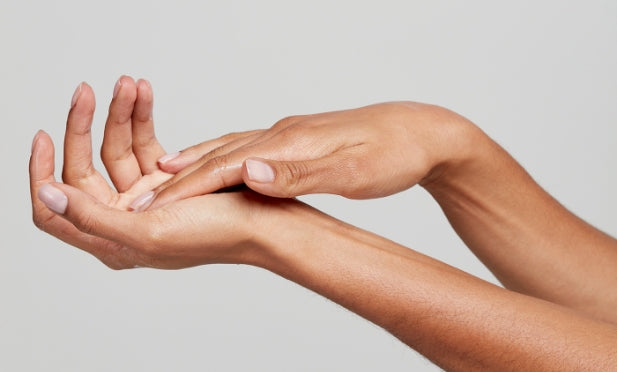  woman using hand serum