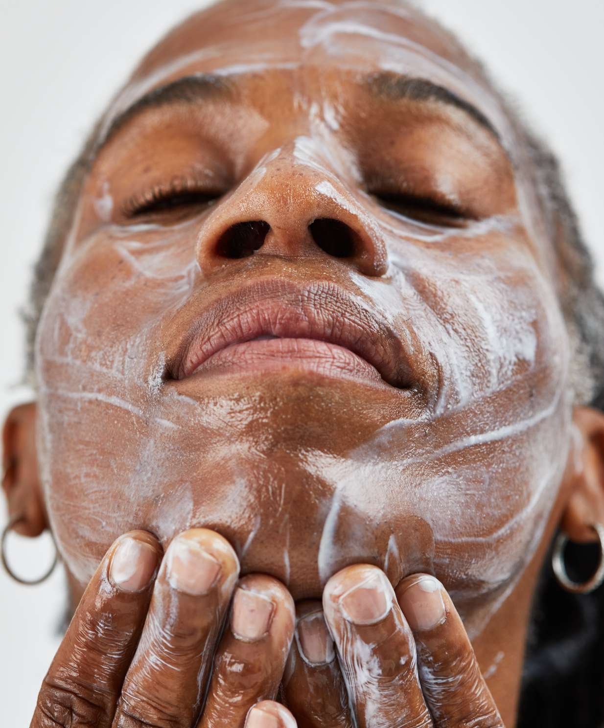 woman applying organic face mask