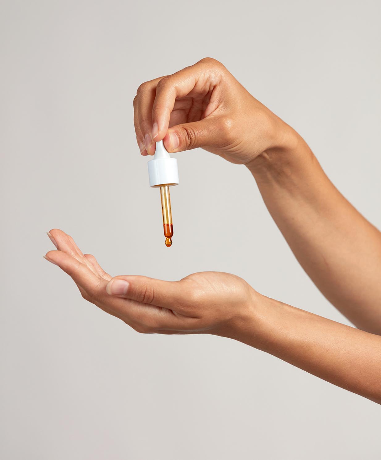 woman using rosehip oil