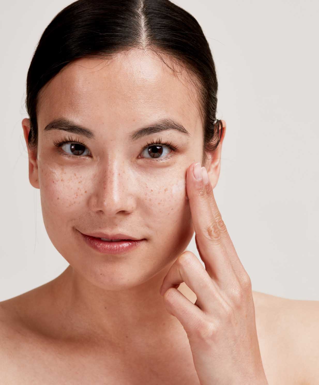 woman applying serum