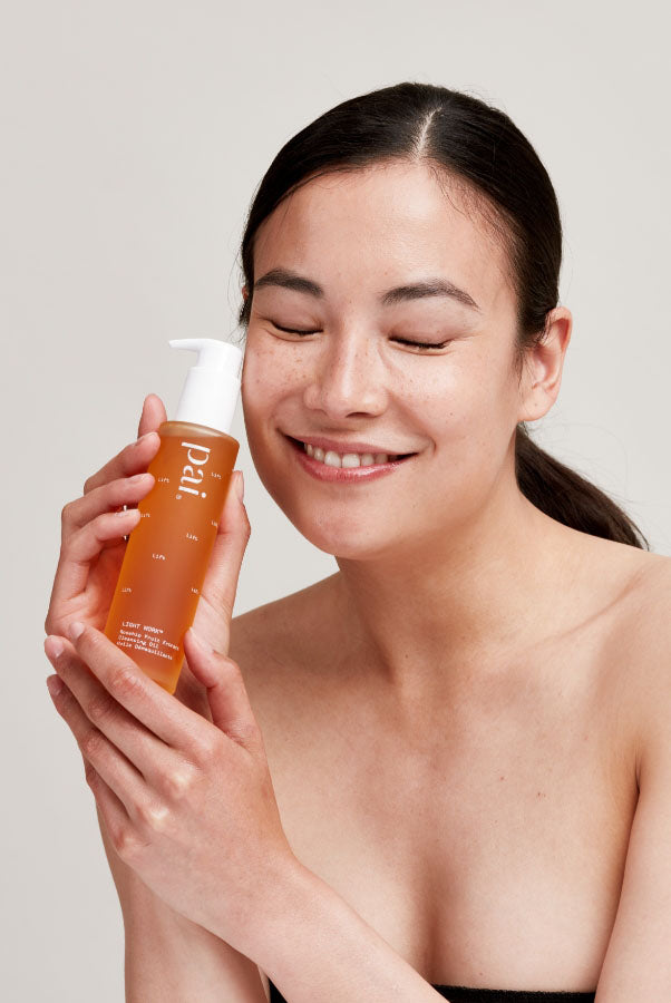 woman with oil cleanser