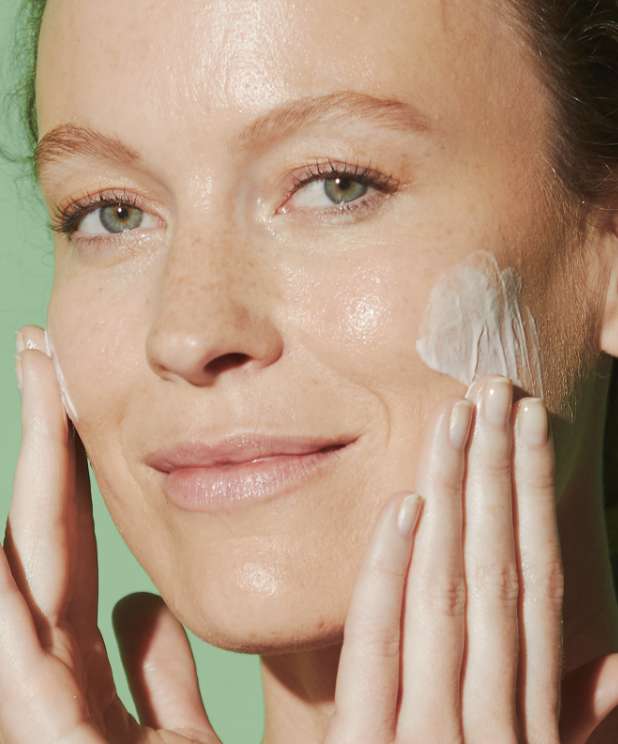 woman applying cream