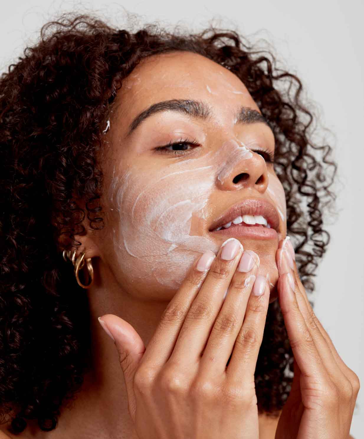 woman using cleanser