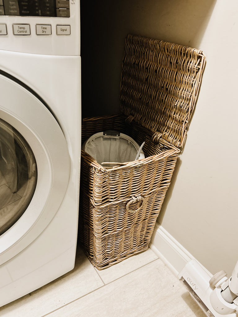 small laundry room vintage basket hiding trash can