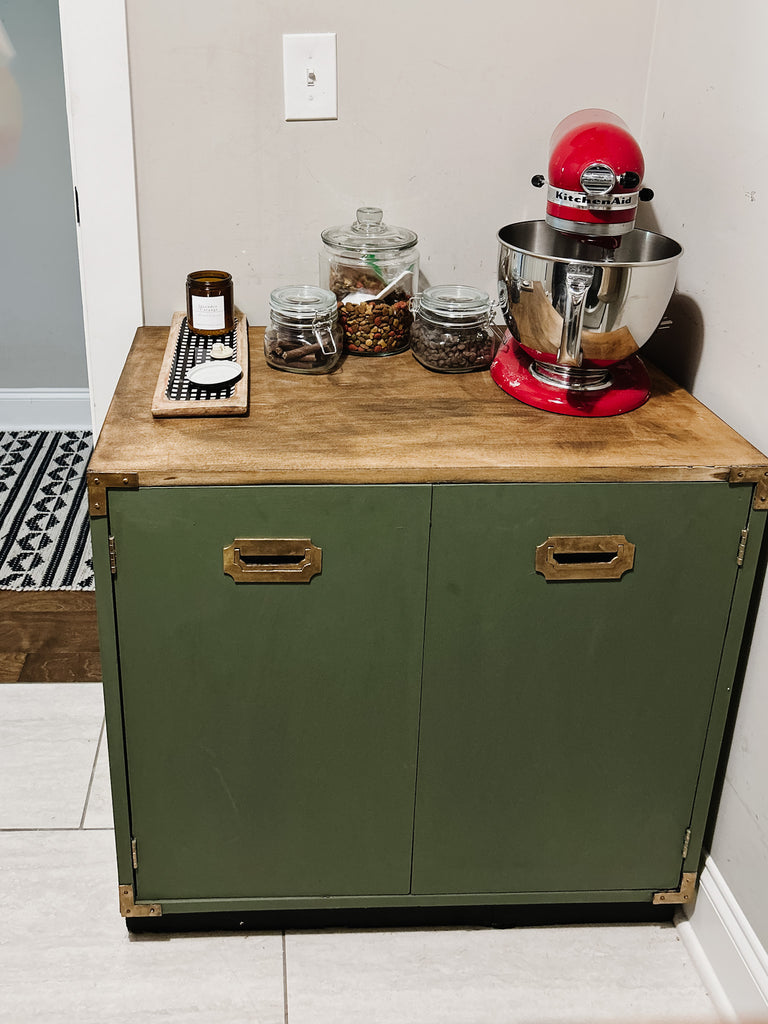 Vintage cabinet in small laundry room for storage