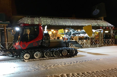 Birkie Groomer working hard to get downtown Hayward, WI Main Street ready for the Birkie