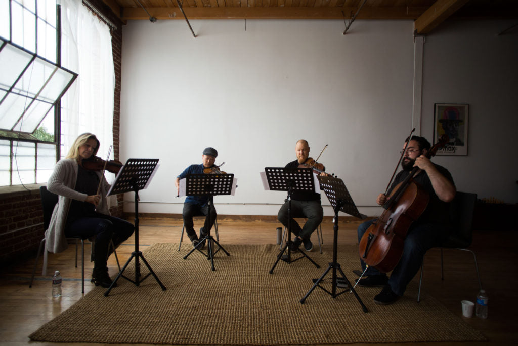 Vitamin String Quartet reading at a loft in Los Angeles, Cali., on Wednesday, Oct. 12, 2016. (© 2016 Jenna Schoenefeld. CMH Label Group/VSQ Usage only.)