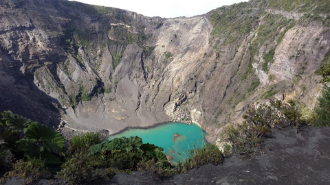 lake at the bottom of mountain range