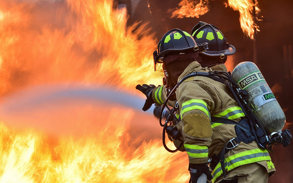 two firefighters fighting fire