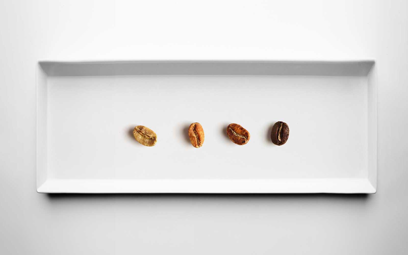 Four different grades roasting coffee beans