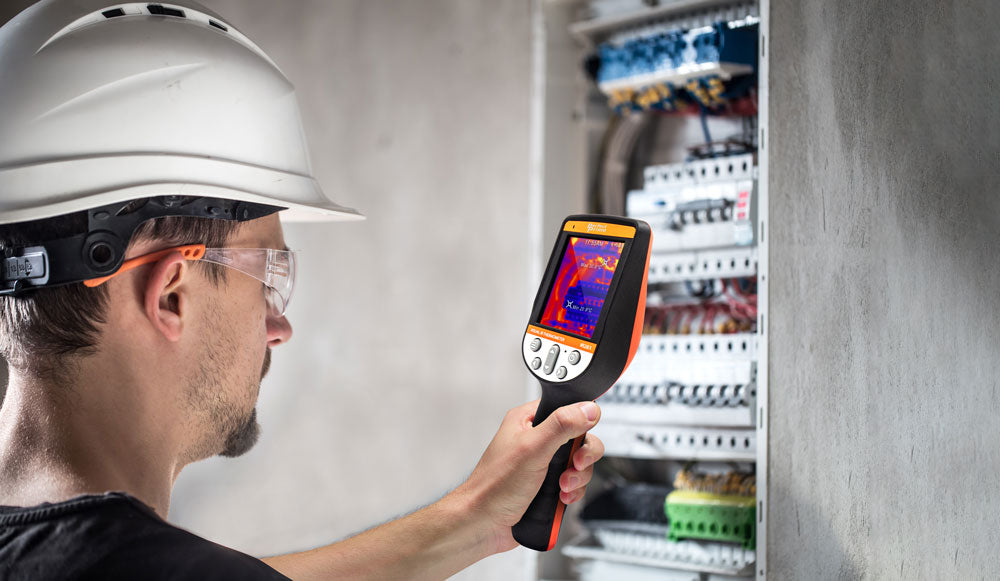 man electrical technician with switchboard