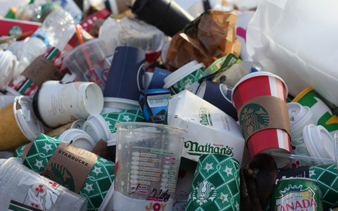 Mound of garbage with majority being starbuck's cups