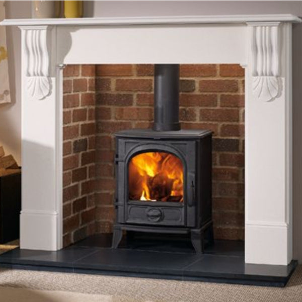 Stone fireplace surround; The Stove House: Survey & installation service for woodstoves HETAS reg. woodburner fitters Woodburner showrooms displaying ecodesign ready log bioethanol & electric fires for Chichester West Dean Haslemere Selsey etc..in West Sussex Surrey & Hampshire