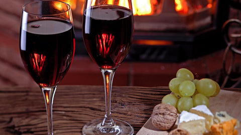 night in front of the fire with a glass of wine - The Stove House 01730 810931