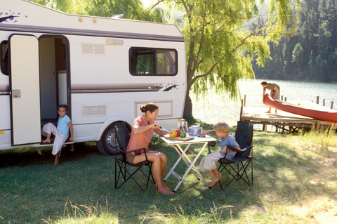 Family camping next to river